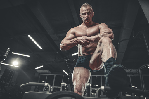 Handsome Model Young Man Training Legs In Gym Stock Photo - Download Image  Now - Abdominal Muscle, Abstract, Active Lifestyle - iStock