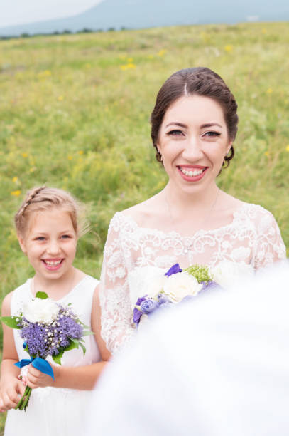 istock Little daughter next to her mother who is getting married 876241082