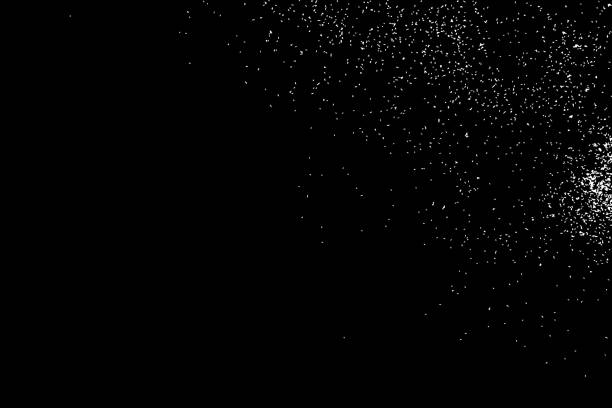 istock Abstract grainy texture isolated on black background. Silhouette of food flakes such as salt or almond or wheat flour spread on the flat surface or table. Top view. Dust, sand blow or bread crumbs. 876241232