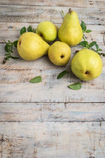 istock Fresh organic pears on old wood. Fruit background. Pear autumn harvest 876242858
