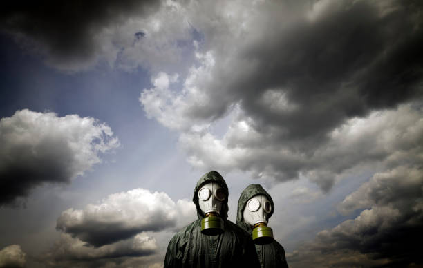 istock Two gas masks and dramatic sky. Survival concept. 876250460