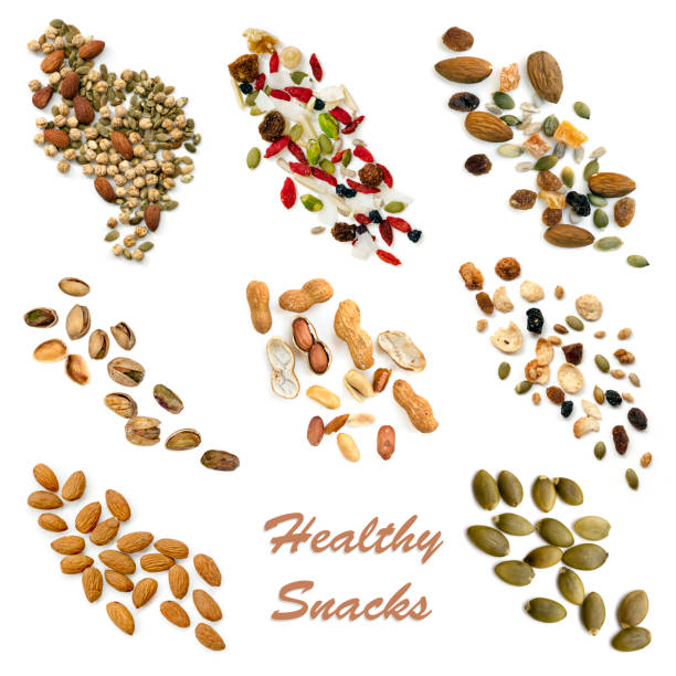 Healthy Snacking Food Collection Healthy snacking collection isolated on white.  Includes seeds, nuts, trail mix, sweet potato fries, vegetable crisps and carrot sticks. dried fruit on white stock pictures, royalty-free photos & images