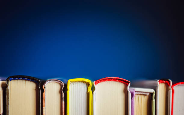 colorful books on the table. closeup of counterfoils. - proof of love imagens e fotografias de stock