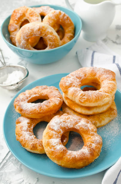 istock Homemade fried vanilla cottage cheese donuts on a white concrete background 876274202