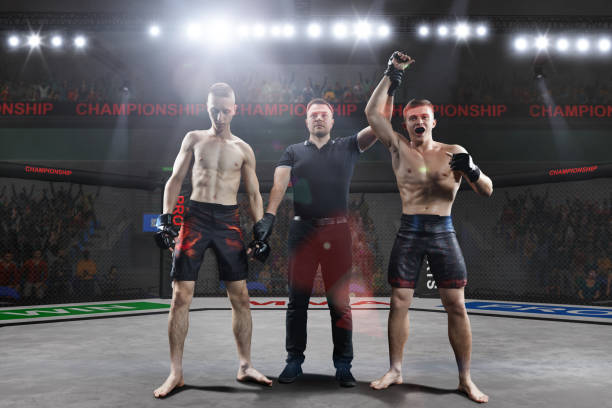istock referee is declairing the winner after the mma fight 876275488
