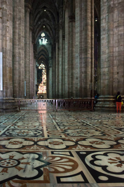 Inside Duomo cathedral in Milan Milan: Inside Duomo cathedral in Milan, detail of the decorated floor in candoglia marble with flower pattern candoglia marble stock pictures, royalty-free photos & images