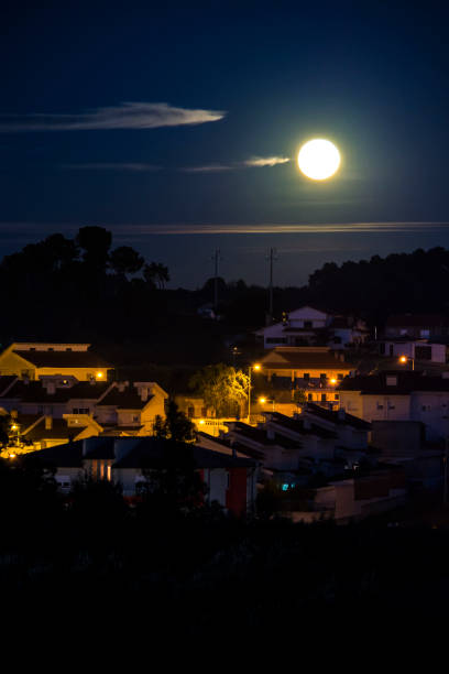 istock Moonrise in the city. 876276210