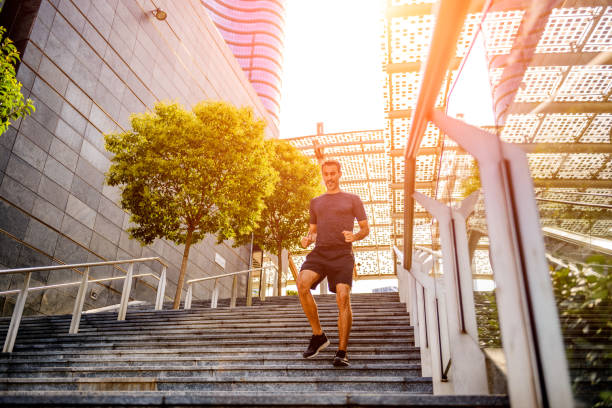 istock Sporty man running downstairs 876276244