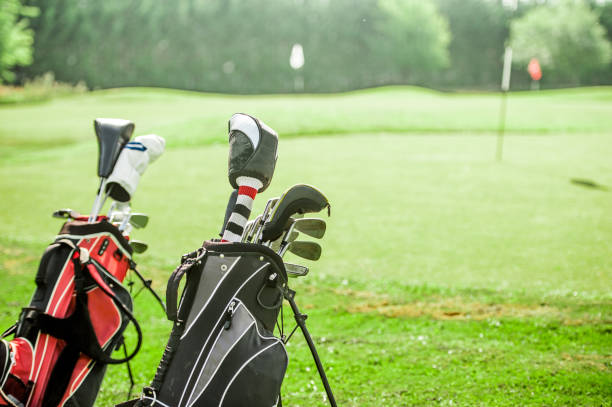 istock Golf Bags With Golf Clubs On Golf Course 876286780