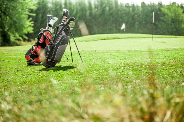 istock Golf Bags With Golf Clubs On Golf Course 876287048