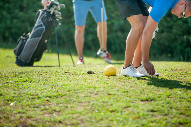 istock Footgolf Player Place The Golf Ball On Tee 876287152