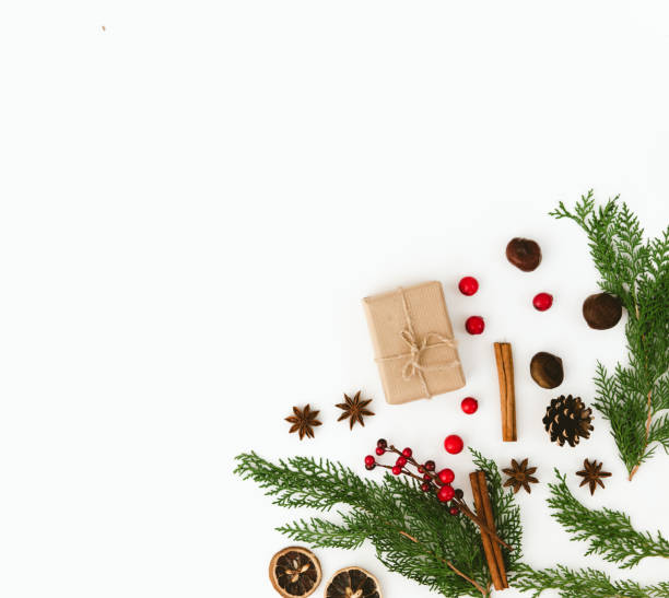 istock Christmas composition with gift box and decorations over white background. Flat lay. Copy space 876289470