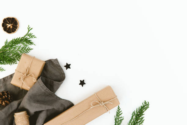 istock Christmas composition with gift and fir brunches over white background. Flat lay, copy space 876289546