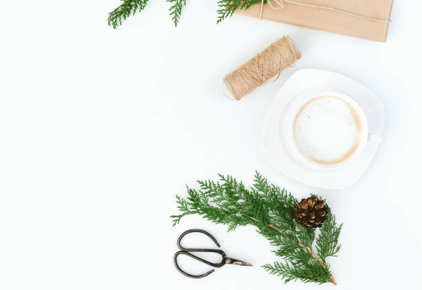 istock Cup of coffee, gift, larch branches, cinnamon sticks, christmas composition flat lay 876289636