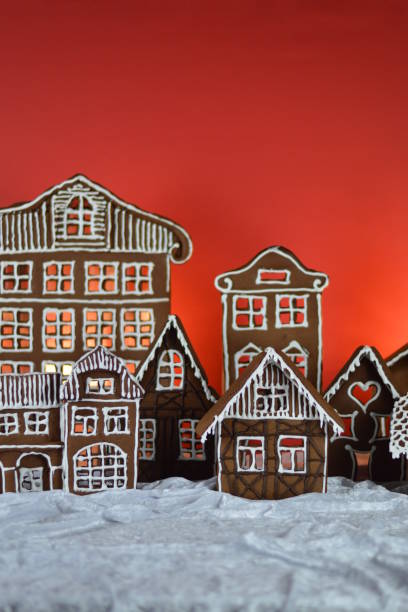 istock home made gingerbread village with red background 876292014