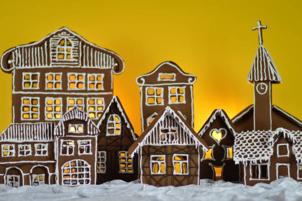 istock home made gingerbread village with yellow background 876292488