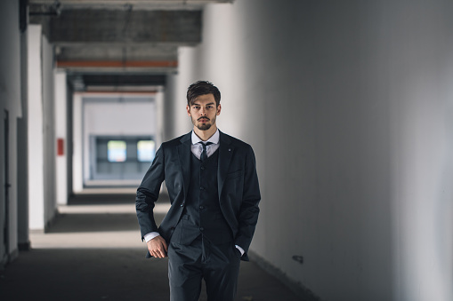 Manager man walking in stadium hallway