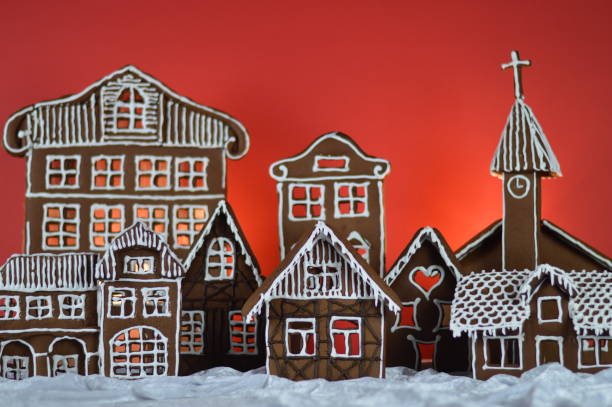 istock home made gingerbread village with red background 876297132