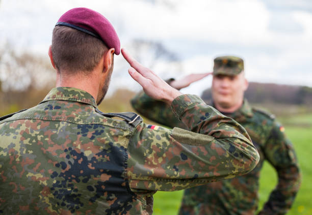 two german soldiers salute each other two german soldiers salute each other german armed forces stock pictures, royalty-free photos & images