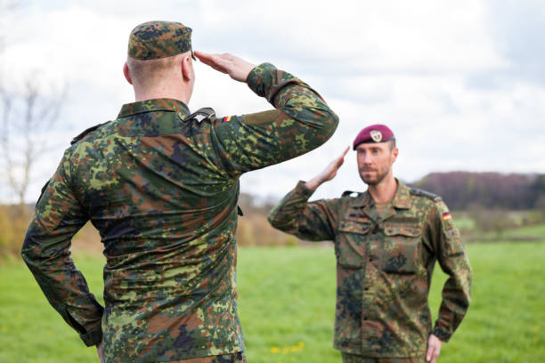 istock two german soldiers salute each other 876303506
