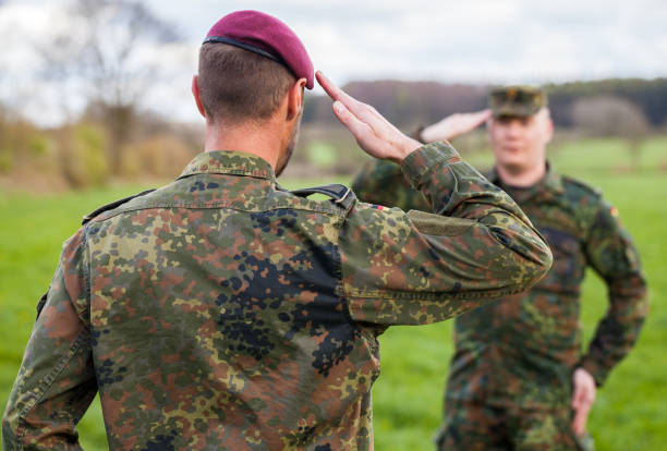 istock two german soldiers salute each other 876303508