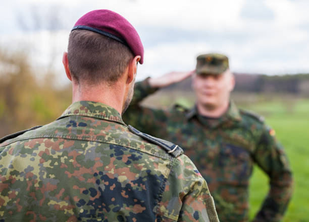 istock two german soldiers salute each other 876303516