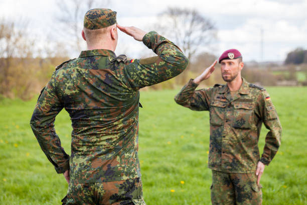 istock two german soldiers salute each other 876303518