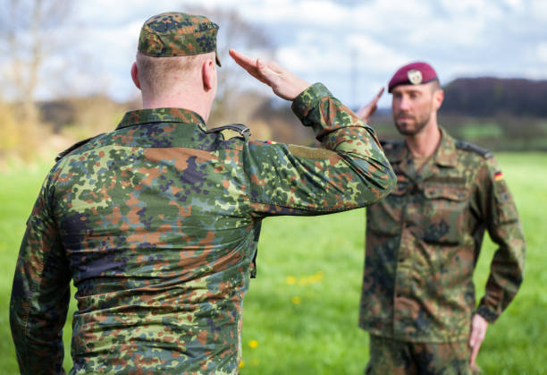 istock two german soldiers salute each other 876303524