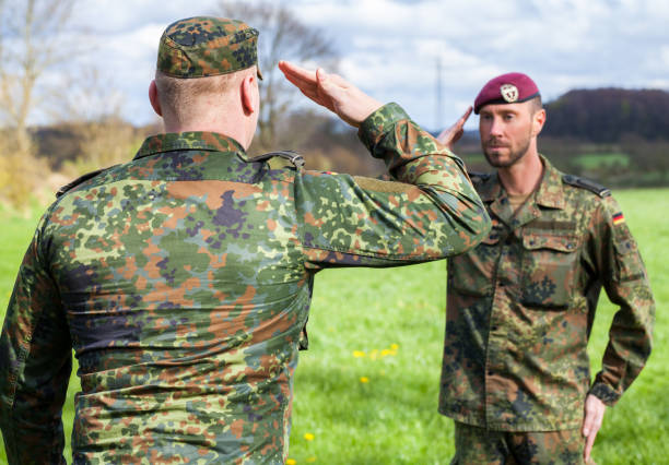 istock two german soldiers salute each other 876303528