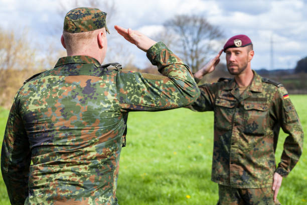 istock two german soldiers salute each other 876303534