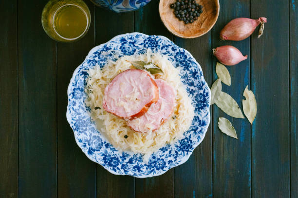 Blue plate with sauerkraut and spareribs on a table