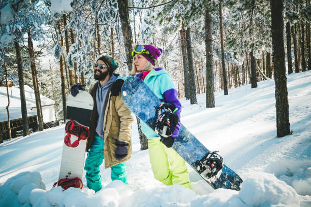 istock Two snowboarders on winter vacation 876322050