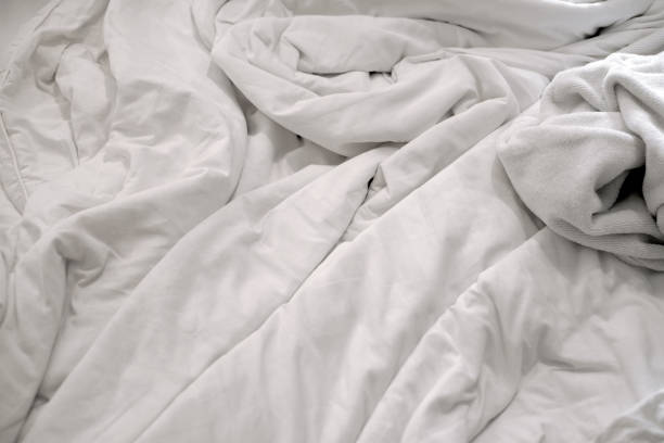 istock White delicate soft background of fabric or bedding sheet 876359800