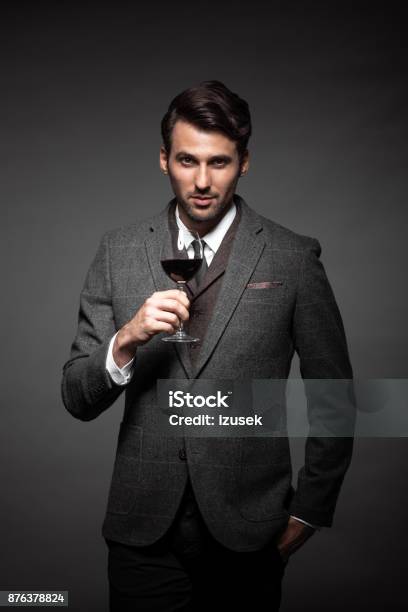 Handsome Young Man With A Glass Of Wine Stock Photo - Download Image Now - Intelligence, Wine, 30-34 Years