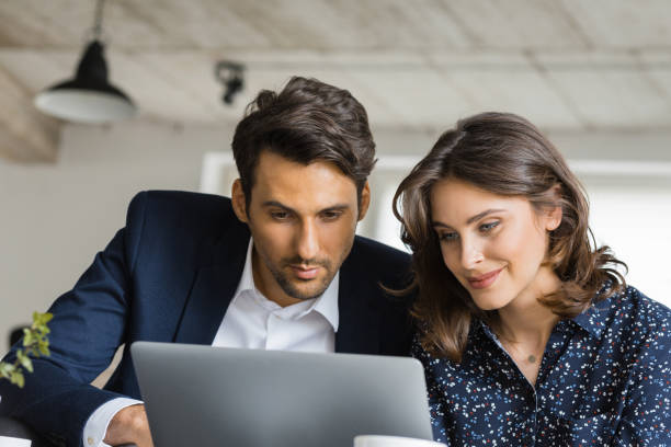 istock Business people at cafe working on laptop 876387992