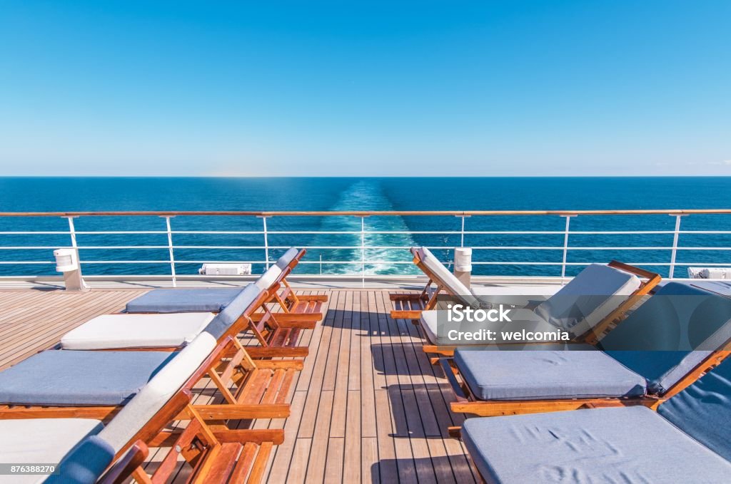 Cruise Ship Vacation Travel Cruise Ship Vacation. Sea Travel Concept with Deckchairs on the Vessel Deck. Cruise Ship Stock Photo