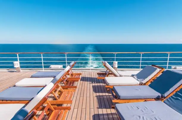 Cruise Ship Vacation. Sea Travel Concept with Deckchairs on the Vessel Deck.