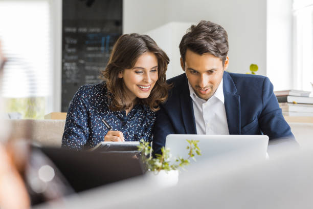 istock Business people working with laptop in cafe 876388516