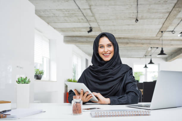 istock Happy muslim woman working in the office 876396604