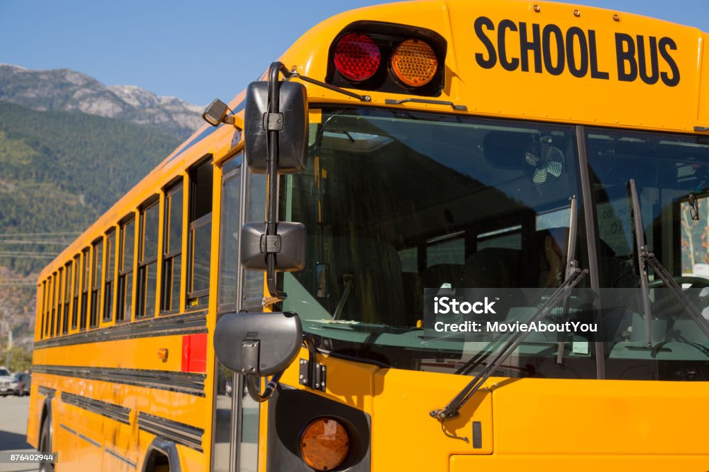 Yellow american schoolbus background closeup School bus North America sunny day countryside Education Stock Photo