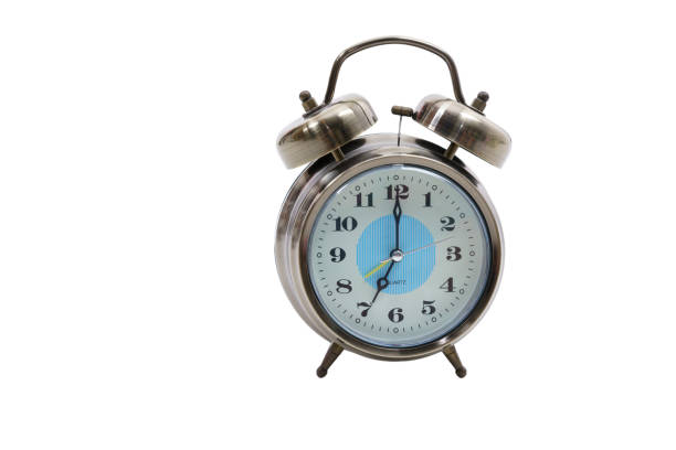 istock Traditional wind-up (keywound), mechanical, spring-driven alarm clock isolated on white background 876403052