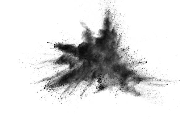 istock Closeup of black dust particles explosion isolated on white background. 876409818