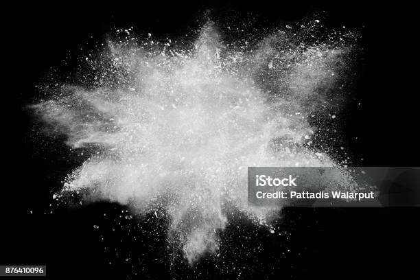 Freeze Motion Explosion Of White Dust On Black Background By Throwing Talcum Powder Out Of Hand Stopping The Movement Of White Powder On Dark Background Stock Photo - Download Image Now