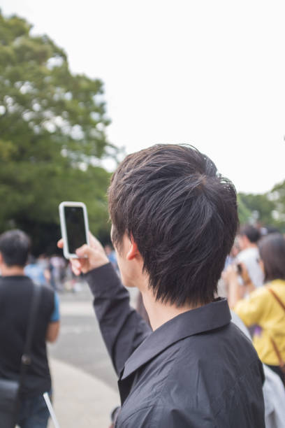 istock Man taking pictures with a smartphone 876410556