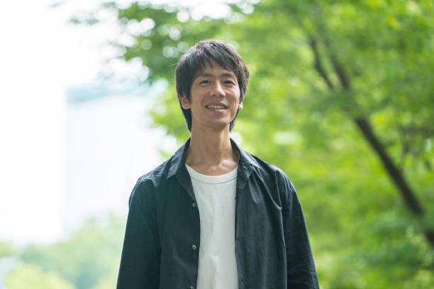 istock Man walking in the eco city 876414124