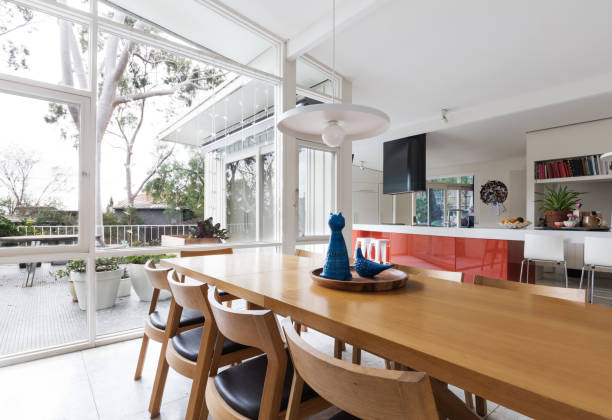 Scandinavian styled dining room and open plan kitchen stock photo