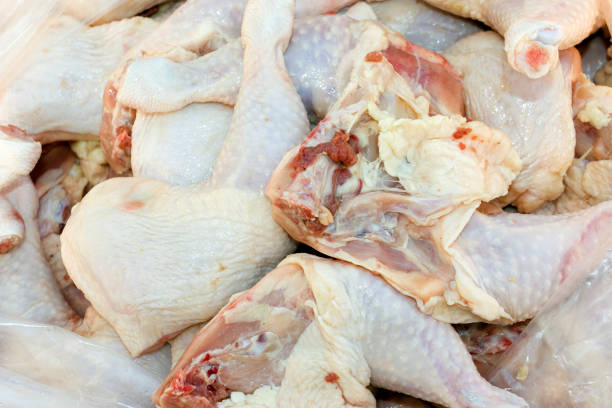 istock Background of raw chicken thighs. 876423650