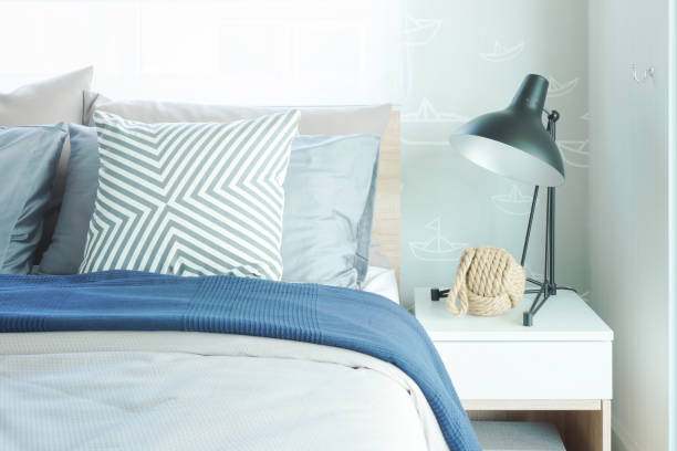 istock Modern classic style interior bedroom with pillows and black reading lamp on bedside table 876424168