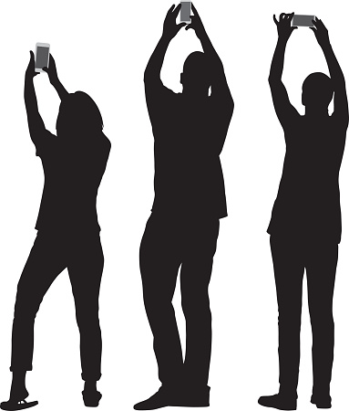 Vector silhouettes of three people taking pictures with their smart phones.