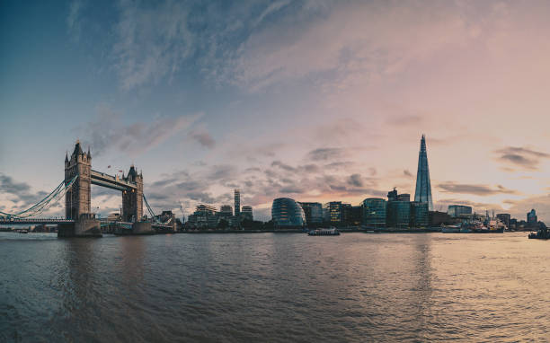 istock London Tower Bridge and The Shard illuminated over Thames panorama 876428288
